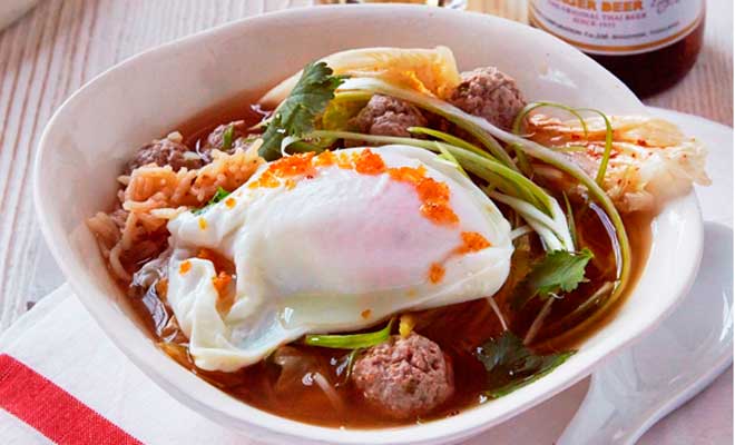 Thai rice soup with pork balls, ginger and poached egg